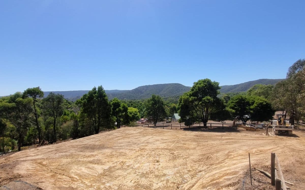 freshly graded building pad on a rural block with the ranges behind, site cut, melbourne's north east